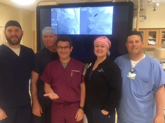 A smiling group of CIS staff poses with the new Micra pacemaker