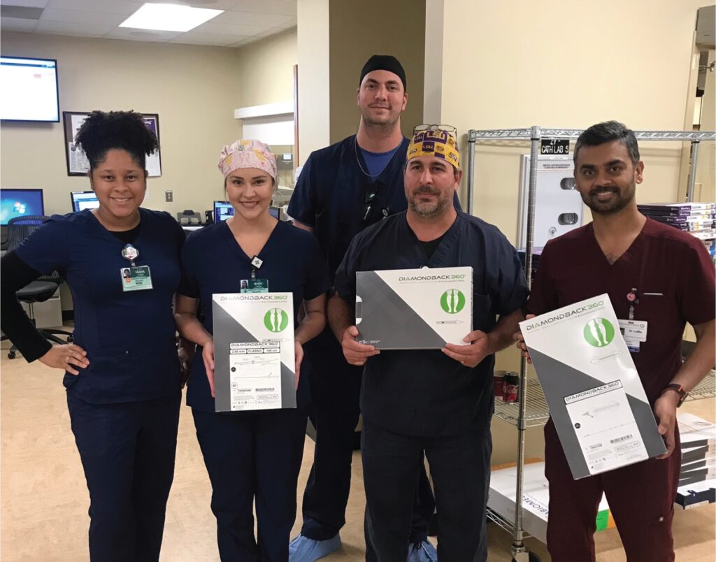 CIS staff members pose with boxes containing components for the Diamondback 360® Peripheral Orbital Atherectomy System