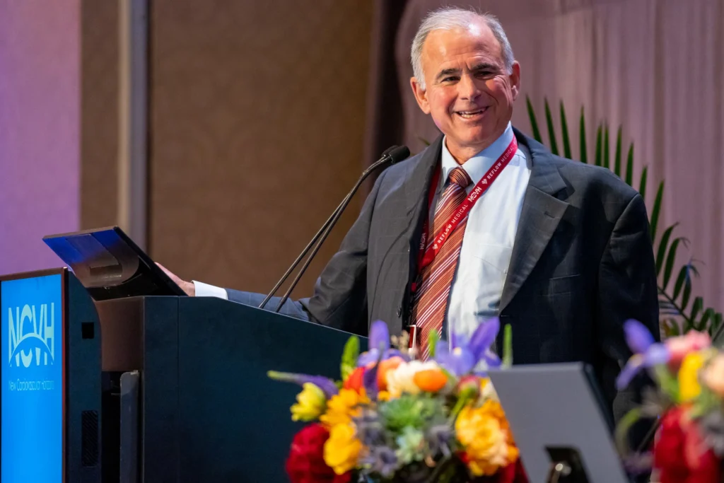 Dr. Craig Walker delivering a speech at a lectern