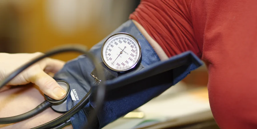 Blood pressure measurement in progress with a sphygmomanometer at the Cardiovascular Institute of the South.