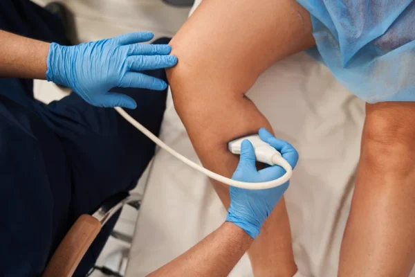 Healthcare professional conducting an ultrasound examination on a patient's heart.