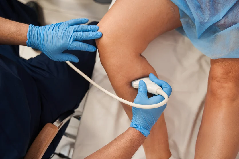 Healthcare professional conducting an ultrasound examination on a patient's heart.