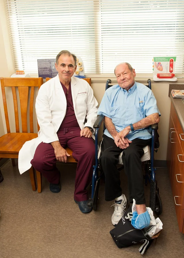 A doctor and a patient sitting together in an exam room